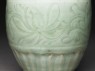 Greenware funerary vase with flowers and a bird (detail)