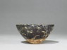 Black ware tea bowl with 'tortoiseshell' glazes (side)