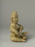 Greenware burial figure of man playing a harp (side)