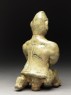 Greenware burial figure of man holding a staff (back)