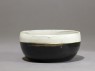 Black ware bowl with white rim (oblique)