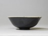 Black ware bowl with white interior and black exterior (side)