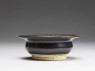 Black ware bowl with iron glaze (side)