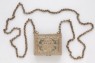 Hirz, or amulet case, containing inscribed paper (bottom)