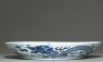 Blue-and-white dish with dragons chasing a flaming pearl (side)