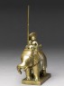 Toy soldier with elephant and driver (side)
