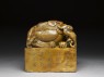 Soapstone seal surmounted by shishi, or lion dog, and seven pups (side)