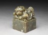 Jade seal surmounted by lion-dog with four pups and ball (oblique)
