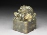 Jade seal surmounted by lion-dog with four pups and ball (oblique)