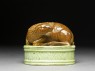 Porcelain seal surmounted by a deer (side)