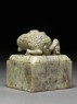 Soapstone seal surmounted by a ram and two lambs (side)