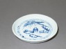 Blue-and-white dish with a figure in a landscape (oblique)