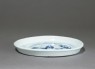 Blue-and-white dish with a figure in a landscape (oblique)