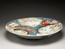 Dish with a shishi, or lion dog, amid animals and flowers (oblique)