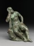 Figure of the hero god Heracles with his club seated on a lion (side)