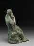Figure of the hero god Heracles with his club seated on a lion (side)
