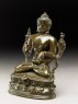 Seated figure of the Buddha with flowers, stupa, and bottle (side)