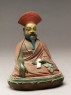 Seated figure of a philosopher, possibly Nagarjuna (side)