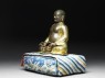 Figure of Hvashang seated on a cushion (side)