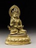 Seated figure of a deity holding a spoon and pot (side)