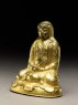 Seated figure of a monk with a robe draped over his head (side)