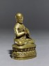 Figure of a seated lama (side)