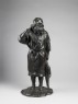 Figure of an Ainu fisherman with his catch (side)