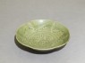 Greenware bowl with ducks amid waves (oblique)