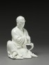 Seated figure of the Buddhist disciple Lohan (side)
