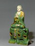 Roof ridge tile in the form of a seated Buddhist figure (side)
