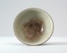 Greenware bowl with 'golden thread and iron wire' glaze (oblique)