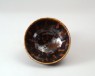 Black ware bowl with russet iron splashes (oblique)