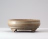 Greenware narcissus bowl with four feet in the form of ruyi sceptres (oblique)