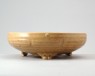 Greenware narcissus bowl with the Eight Trigrams and taotie mask feet (oblique)