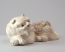 White ware pillow in the form of a lion (oblique)