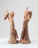 Figure of a dancing lady with raised arm (oblique)