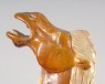 Figure of a camel with saddle in the form of an animal mask (oblique)