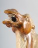 Figure of a camel with saddle in the form of an animal mask (oblique)