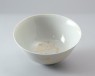 White ware bowl with dragons chasing flaming pearls (oblique)