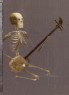 Skeleton kneeling playing a shamisen, or plucked instrument (detail, Cat. No. 38)